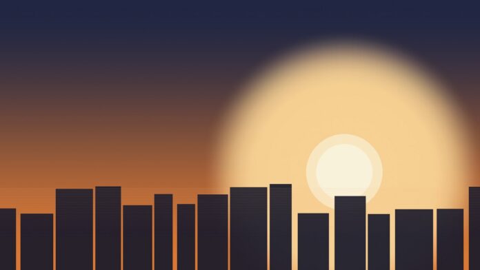 Sol intenso ao fim da tarde sobre uma cidade durante uma onda de calor em Portugal